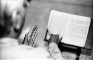 Monk in pagoda at the evening prayer, Can Tho, Mekong Delta - Vietnam, 2000